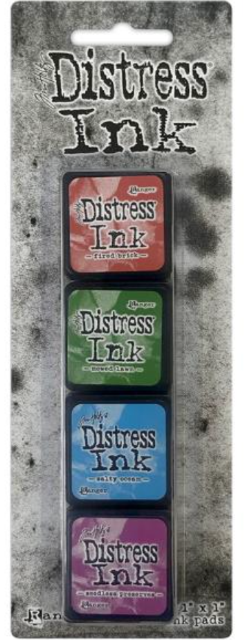 Set of Distress Ink pads in packaging on a textured background