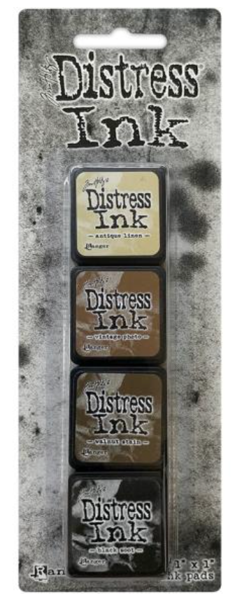 Packaging of Tim Holtz Distress Ink with four ink pads on a textured background