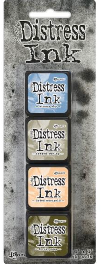 Package of Tim Holtz Distress Ink pads on a textured gray background