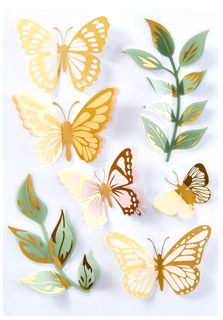 Decorative stickers with butterflies and leaves on a white background