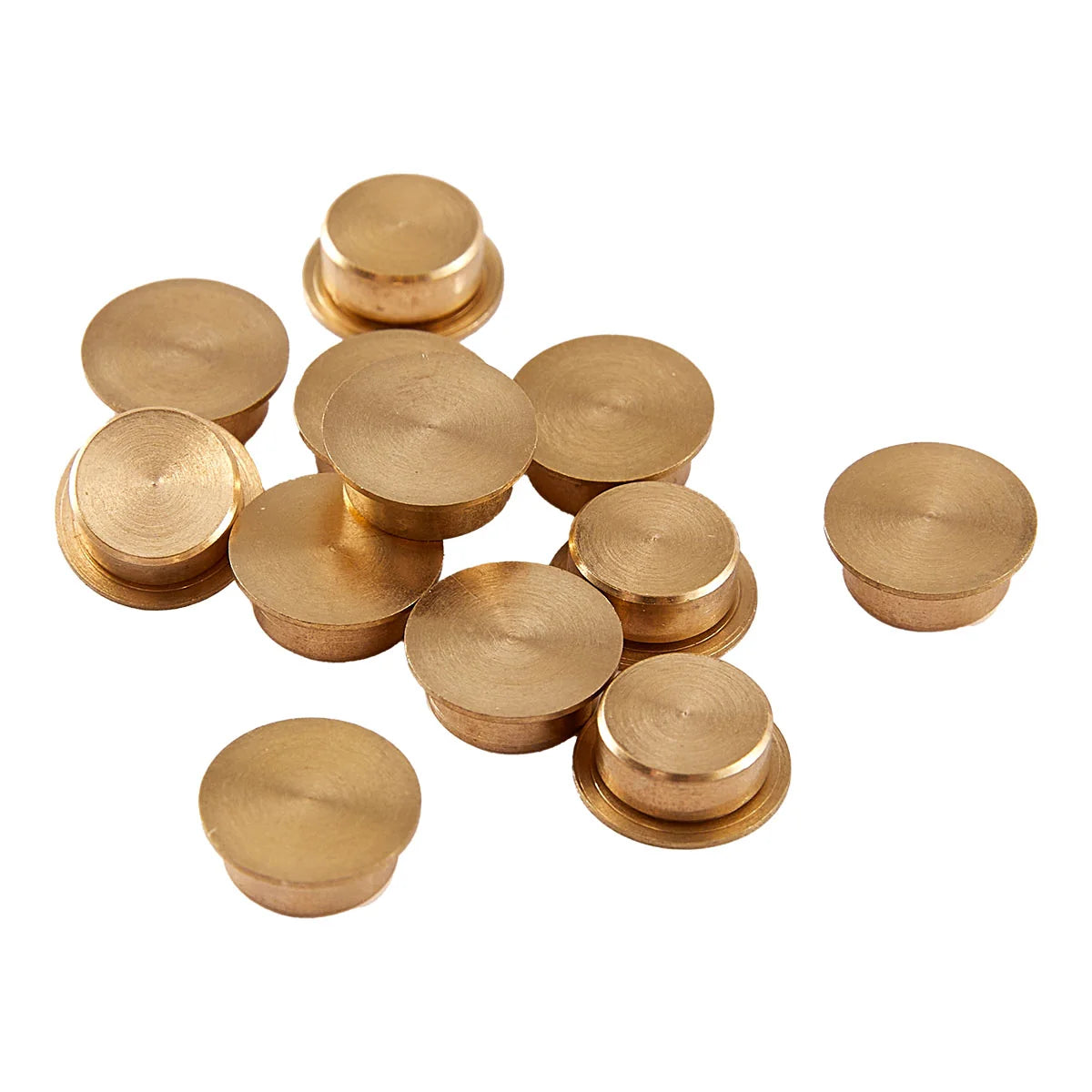 Collection of gold metal knobs on a white background