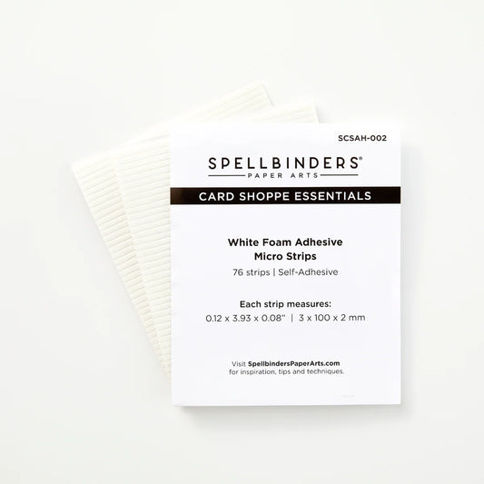 Spellbinders Paper Arts Card Shoppe Essentials White Foam Adhesive Micro Strips package on a clean white background, with a stack of off-white adhesive strips visible behind the front card.