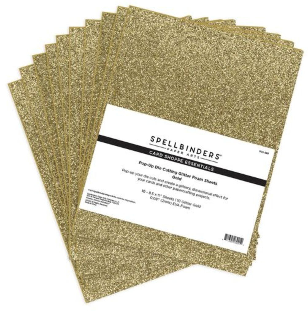 Stack of gold glitter foam sheets with Spellbinders label on a white background