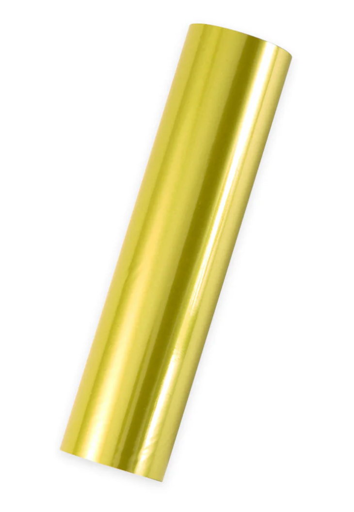 single Roll of spellbinders citrine glimmer foil on a white background