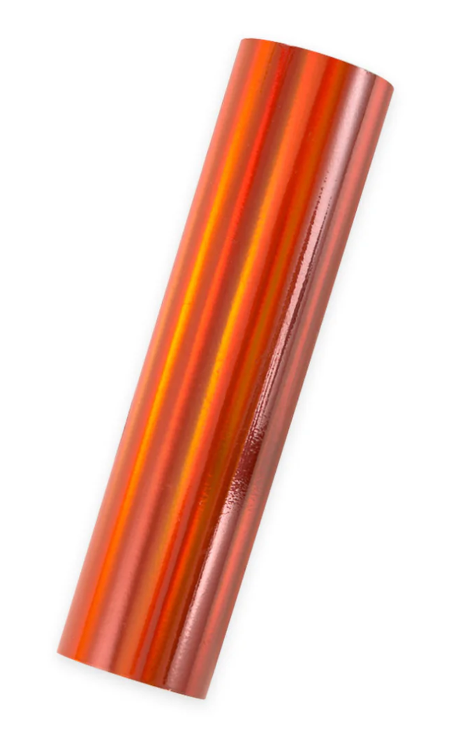 Roll of tangerine orange metallic glimmer foil on a white background