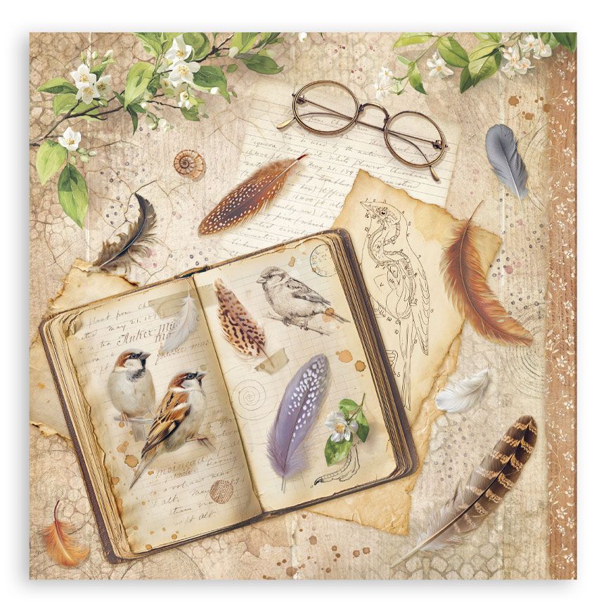 Decorative paper with an open book, feathers, and glasses on a textured background