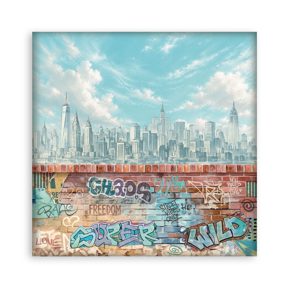 A square sheet of paper depicting a split cityscape: the upper half shows a blue-toned New York City skyline under a cloudy sky, and the lower half shows a graffiti-covered brick wall. The print is centered on a clean white background.