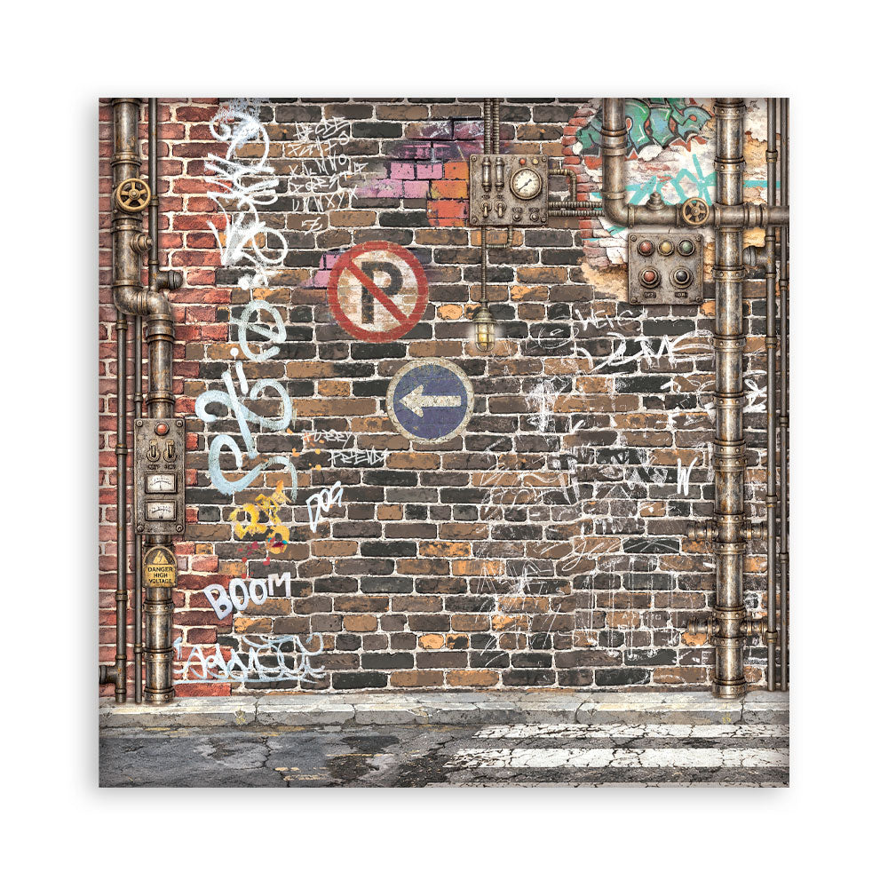 A square sheet of paper depicting an urban brick wall covered in graffiti, white spray paint tags, and vertical metal pipes, shown against a plain white background.