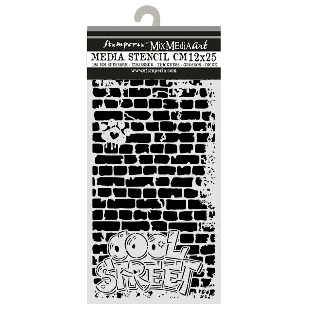 A packaged stencil sheet from Stamperia Mix Media Art, labeled 'MEDIA STENCIL CM12x25'. The stencil features a black brick pattern with a small heart and a graffiti-style 'COOL STREET' design at the bottom, shown on a white backing card with a hanger tab.