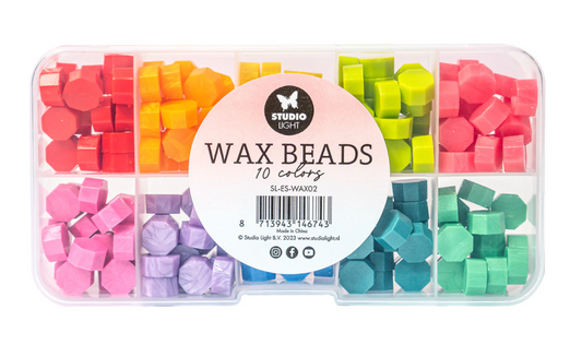 Container of colorful wax beads with a 'Studio' label on a white background
