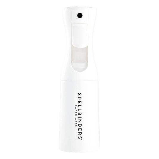 White spray bottle with 'Spellbinders' branding on a white background