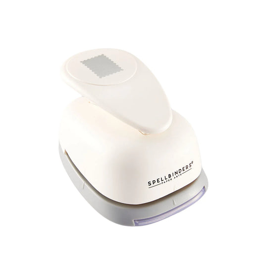 A Spellbinders paper punch tool in off-white plastic with a gray base and a translucent purple indicator window, shown on a solid white background.