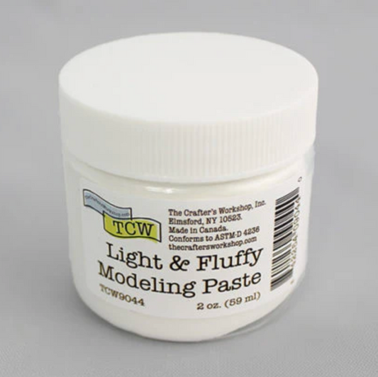 Jar of Light & Fluffy Modeling Paste with TCW branding on a gray background