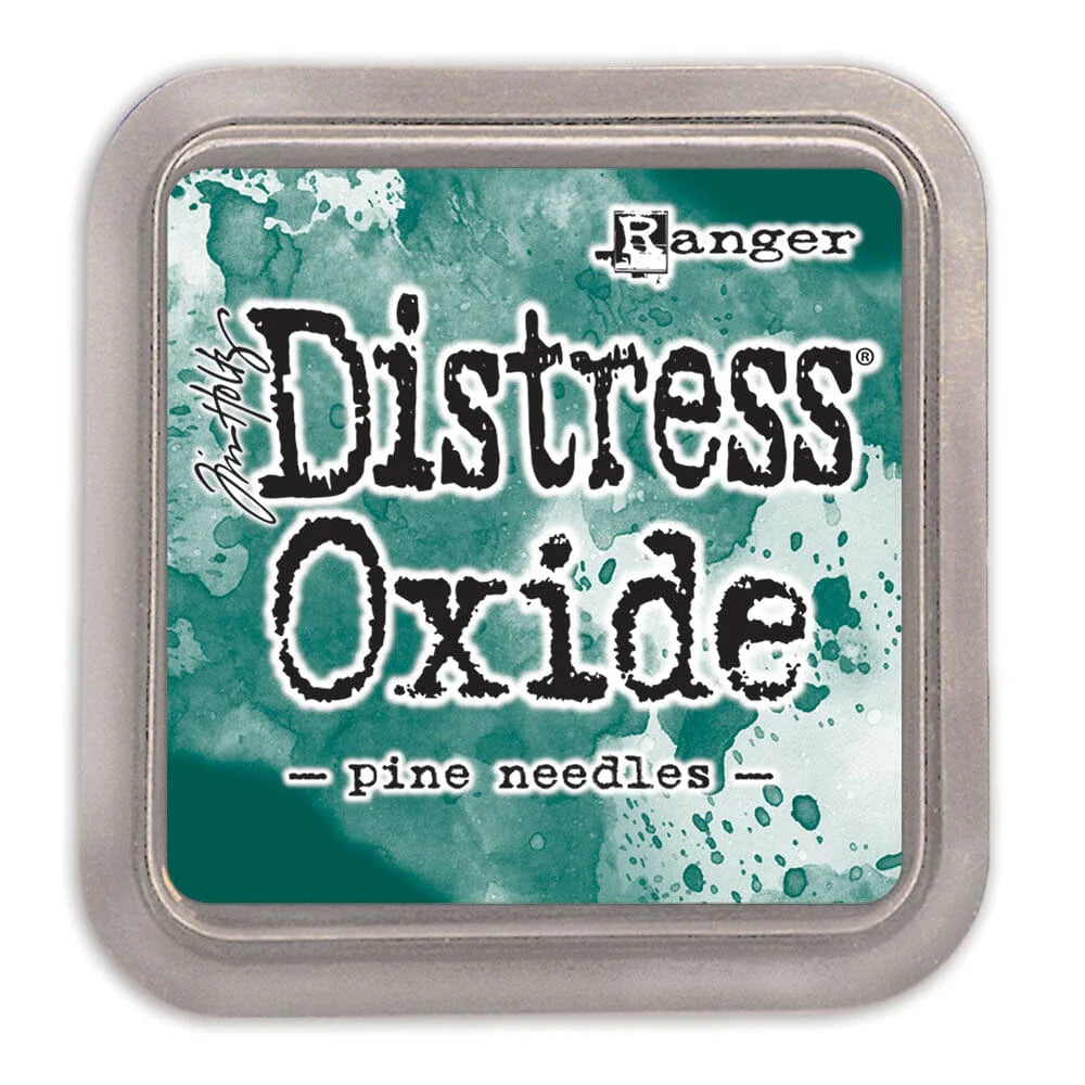 Distress Oxide ink pad by Ranger with a teal and white design