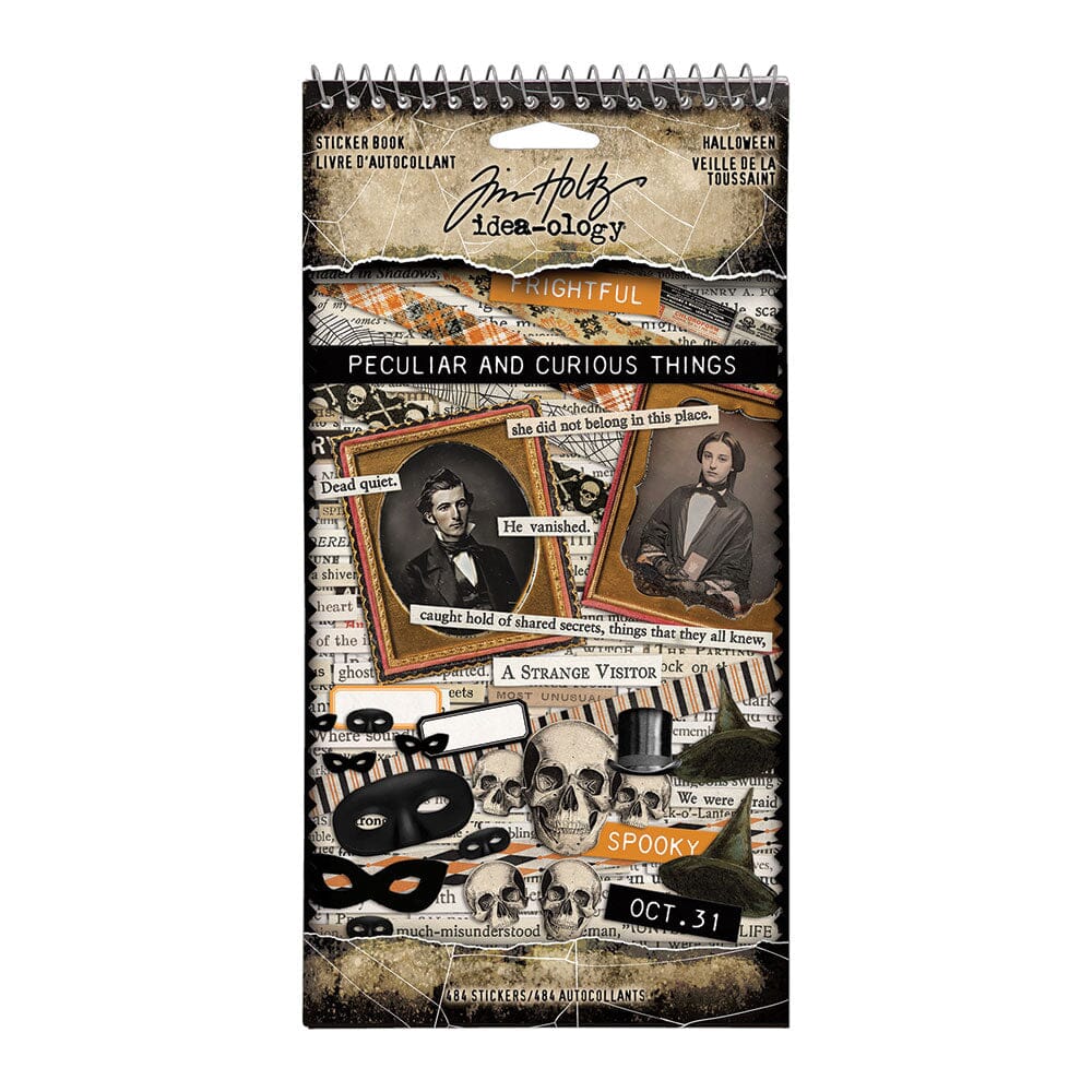 Decorative notebook filled with Halloween-themed  stickers by Tim Holtz on a white background