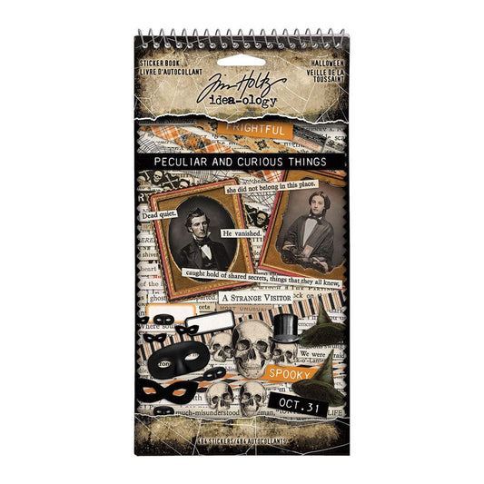Decorative notebook filled with Halloween-themed  stickers by Tim Holtz on a white background