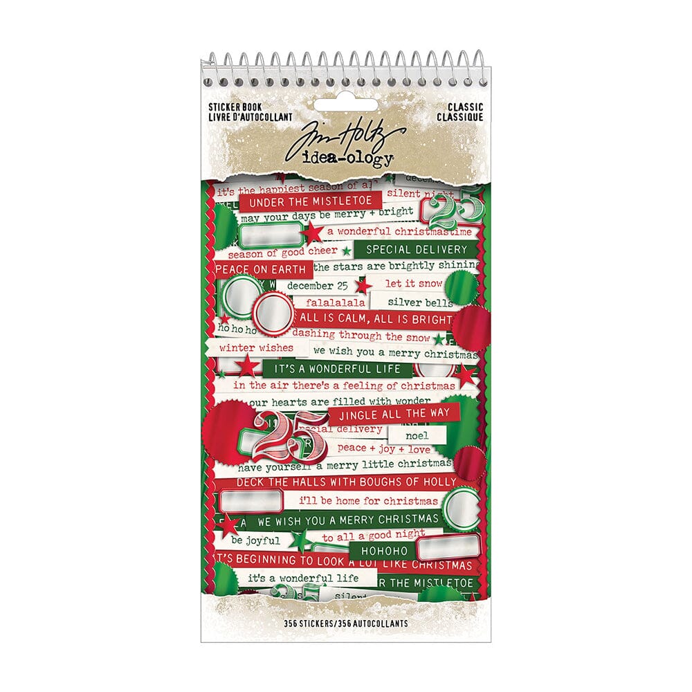 A spiral-bound christmas sticker book by Tim Holtz, featuring festive red, green, and white holiday stickers with Christmas quotes and illustrations on a white background.