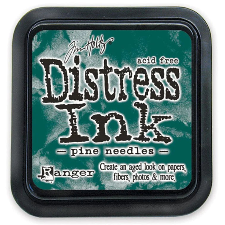 Distress Ink pad by Ranger with 'pine needles' color on a white background