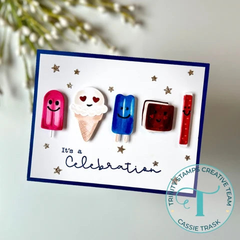 trinity stamps logo over a red, white, and blue ice cream themed hand made card with stars on a backdrop with a floral sprig