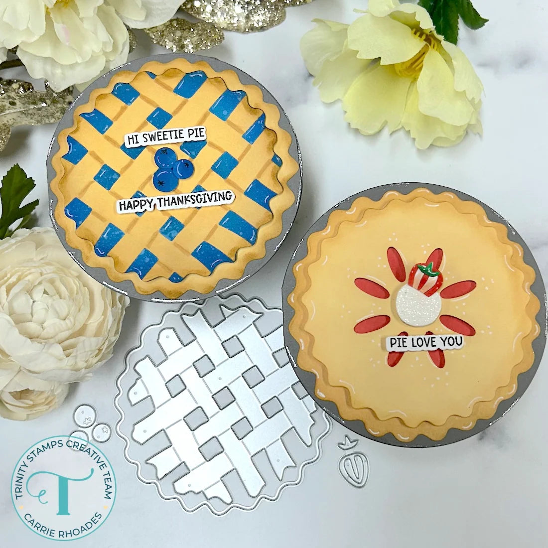 Trinity stamps oh my pie circle shaped blueberry and strawberry pie cards with logo and a flowers in the background