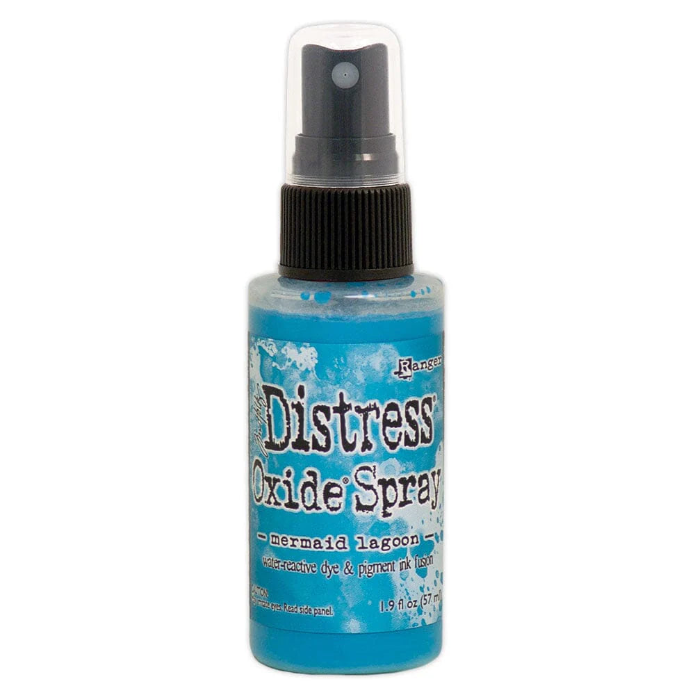 Distress Oxide Spray bottle with blue label on a white background