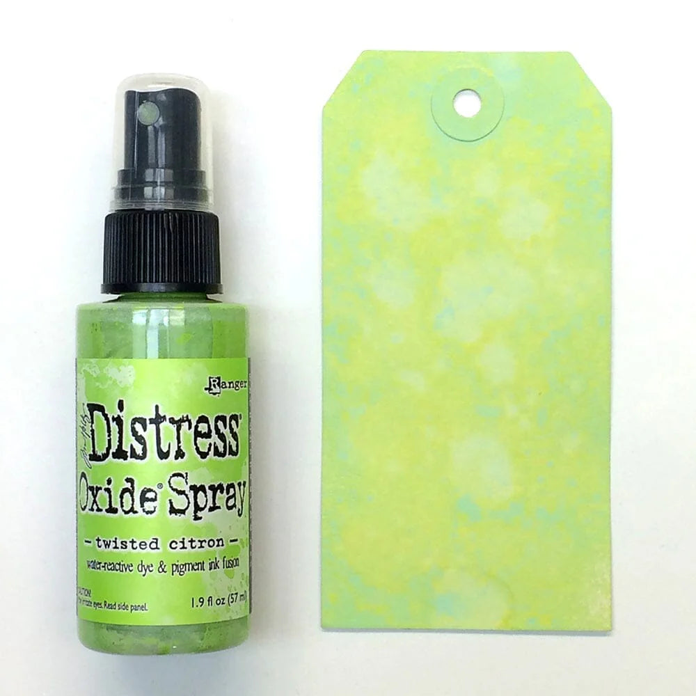 Distress Oxide Spray bottle with a matching twisted citron green tag on a white background