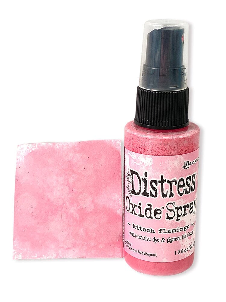 Pink spray bottle labeled 'Distress Oxide Spray' with a matching pink swatch on a white background