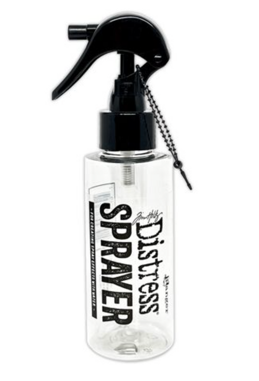 Clear spray bottle labeled 'Distress Sprayer' with black nozzle on a white background
