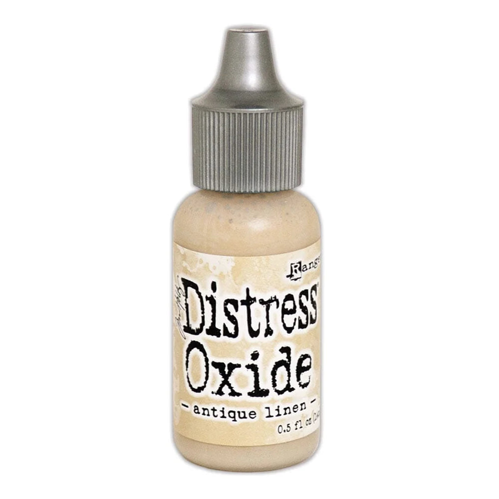 Bottle of Tim Holtz Distress Oxide - antique linen in a bottle with a gray cap on white background