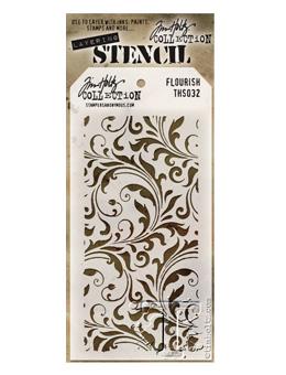 A Tim Holtz Collection Flourish stencil, model THS032, featuring an elegant brown damask scroll pattern on a white sheet, packaged in a gold and white cardboard sleeve.