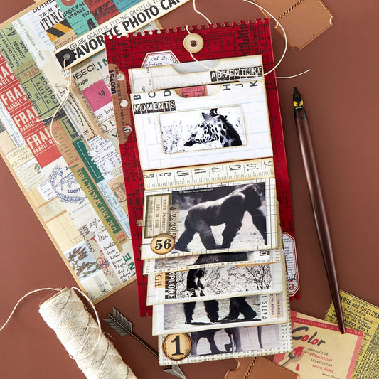 Scrapbook page with animal illustrations and vintage-style paper elements on a brown background.