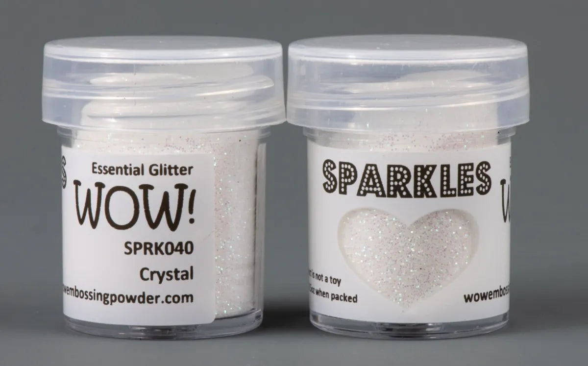 WOW Glitter Sparkle glitter in small bottles with lids on grey background