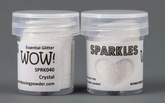 WOW Glitter Sparkle glitter in small bottles with lids on grey background