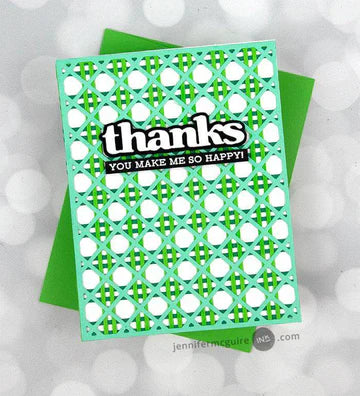 Green card with white polka dots and text on a gray background